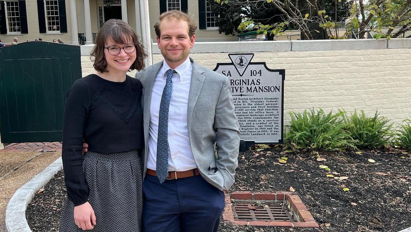 The owners in front of the Virginia Executive Mansion historical marker