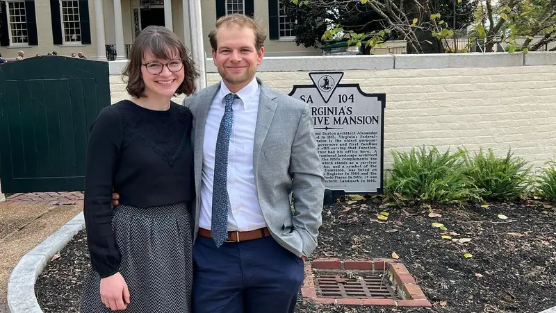 The owners in front of the Virginia Executive Mansion historical marker